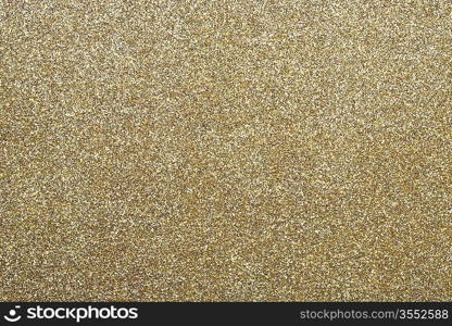 Gold shining paper texture. Holiday abstract background