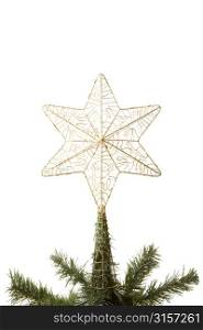 Gold Star On Top Of Christmas Tree Against White Background