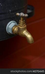 gold tap with red background