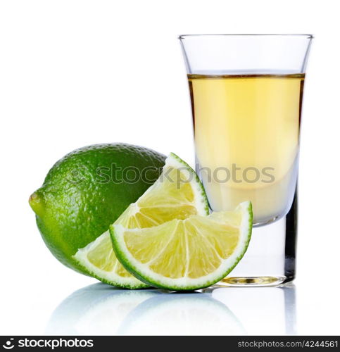 Gold tequila shot with lime isolated on white background