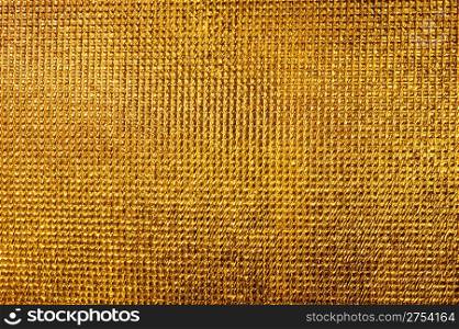 Gold texture. Detailed finely scaly metal surface