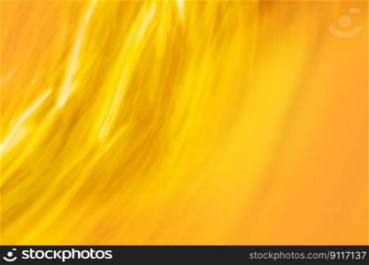 Gold yellow honeyed candied color wave effect abstract background. Blur melliferous honeyed background.. Bokeh effect blurry defocused honeyed candied defocused surface