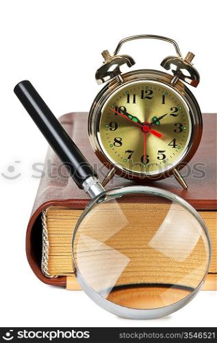 golden alarm clock and magnifying glass on the book isolated on a white background