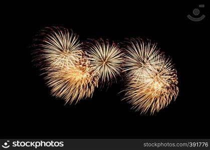 Golden and red exploded fireworks display, isolated on black background