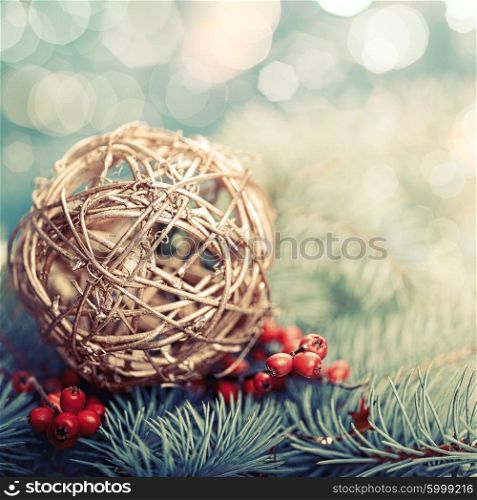 Golden ball. Abstract Xmas decorations over pine tree