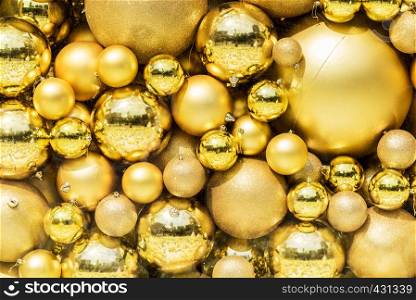 Golden balls pattern on wall for abstract background.