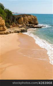 Golden beaches and sandstone cliffs near Albufeira, South Portugal.