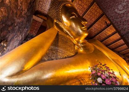 Golden big Buddha face in Wat Pho , Bangkok , Thailand. Grand Palace