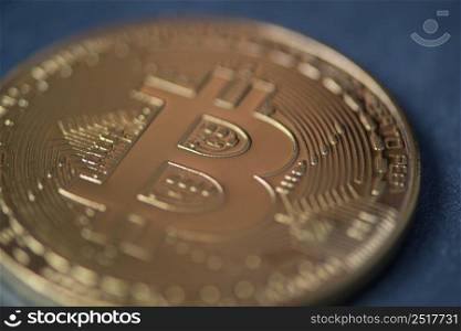 Golden bitcoin closeup, blurred photo. electronic money. coins are bitcoin and litecoin