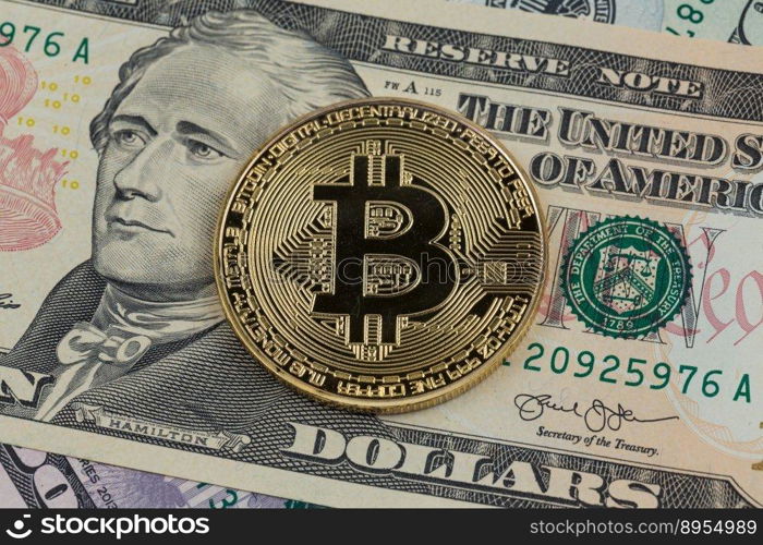 Golden bitcoin coin on a paper dollars money. Virtual  crypto currency. currency.