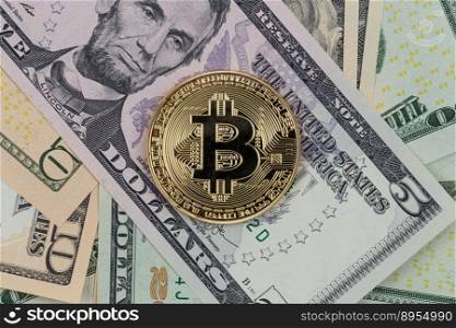 Golden bitcoin coin on a paper dollars money. Virtual  crypto currency. currency.