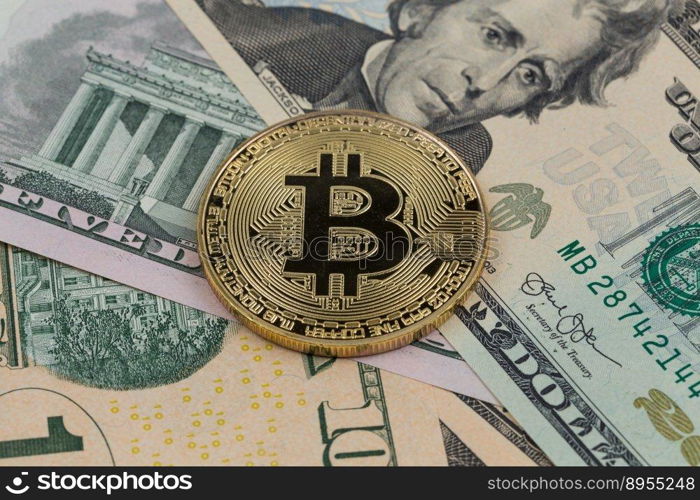 Golden bitcoin coin on a paper dollars money. Virtual  crypto currency. currency.