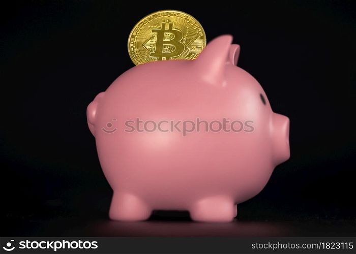 Golden Bitcoin with piggy bank. Cryptocurrency investment concept. virtual money. Cryptocurrency saving piggy bank financial banking concept on black background financial. Golden Bitcoin with piggy bank. Cryptocurrency investment concept. virtual money. Cryptocurrency saving piggy bank financial banking concept on black background