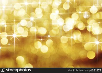 Golden bokeh and shiny stars holiday background