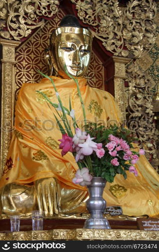 Golden Buddha and shrine in Shwa Dagon paya, Yangon, Myanmar