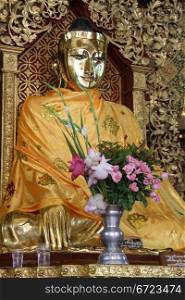 Golden Buddha and shrine in Shwa Dagon paya, Yangon, Myanmar