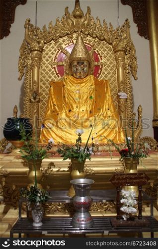 Golden Buddha at night in Buddha&rsquo;s Hair psagoda, Yangon, Myanmar