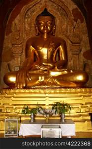 Golden Buddha in buddhist temple in Bagan, Myanmar