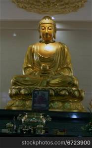 Golden Buddha in buddhist temple, Kuala-Lumpur