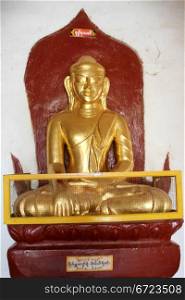 Golden buddha in corridor in Thatbyinnyu Phaya, Bagan, Myanmar