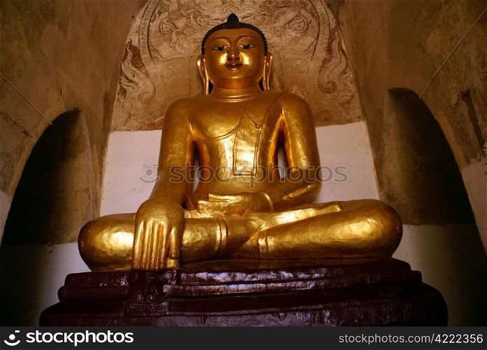 Golden Buddha in old temple in Bagan, Myanmar