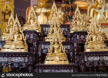 Golden Buddha statue names Buddhachinaraj sit on layer respectively, the most beautiful buddha image of Thailand,can use religious concept background
