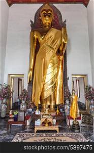 Golden Buddha statues in Wat Pho Temple - Buddhist temple complex in Bangkok, Thailand
