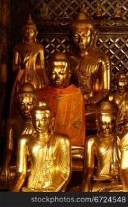 Golden Buddhas in shrine, Shwedagon Paya pagoda in Yangon, Myanmar