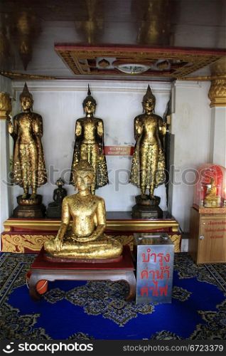 Golden Buddhas in temple in Wat Na Phramain in Ayutthaya, Thailand