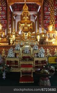 Golden Buddhas inside temple in wat Suan Dok, Chiang Mai, Thailand