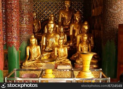 Golden Buddhas on the shrine in Shwedagon Paya, Yangon, Myanmar