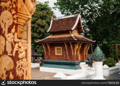 Golden Buddism Mural art and mosaic wall at Main hall of Wat Xieng thong, Luang Prabang, Laos