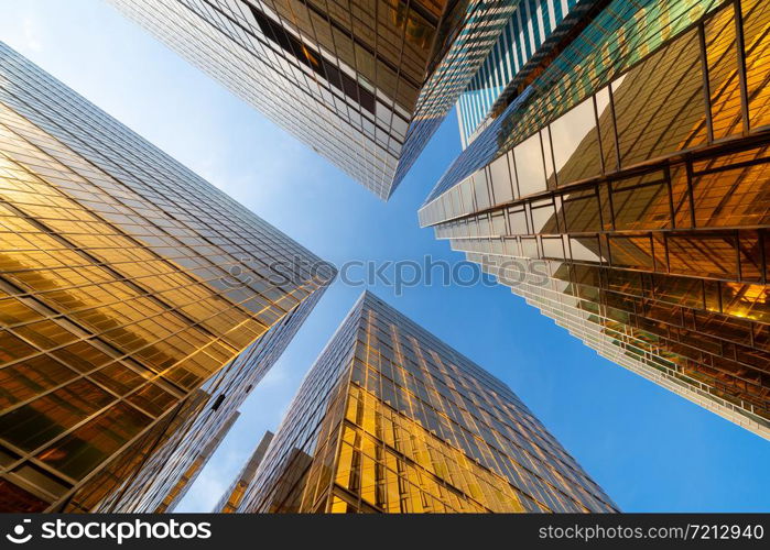 Golden building. Windows glass of modern office skyscrapers in technology and business concept. Facade design. Construction structure of architecture or engineering. Exterior for urban city background