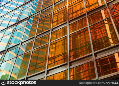 Golden building. Windows glass of modern office skyscrapers in technology and business concept. Facade design. Construction structure of architecture or engineering. Exterior for urban city background