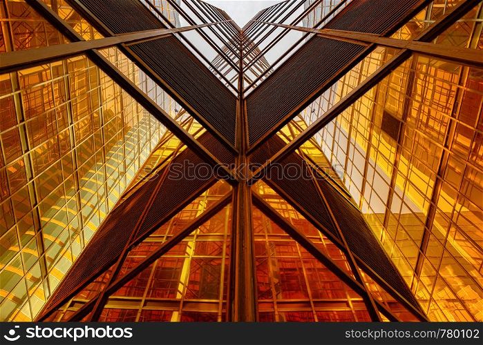 Golden building. Windows glass of modern office skyscrapers in technology and business concept. Facade design. Construction architecture exterior for urban cityscape background.