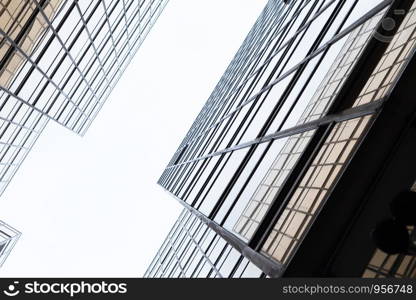 Golden building. Windows glass of modern office skyscrapers in technology and business concept. Facade design. Construction structure of architecture exterior for urban cityscape background.