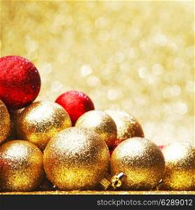 Golden Christmas ball on abstract glitter background