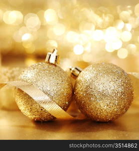 golden christmas ball on golden bokeh background