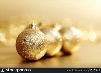 golden christmas ball on golden bokeh background