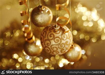 golden christmas balls on bokeh background
