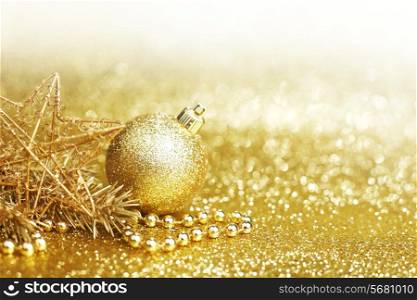 Golden christmas decor on glitter background with copy space