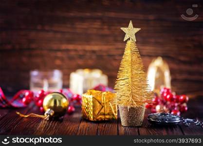 golden christmas decoration on the wooden table