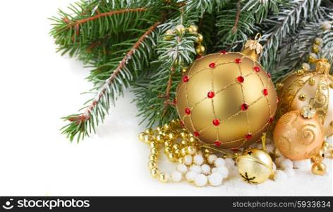 golden christmas decorations with evergreen tree close up on white background. golden christmas decorations