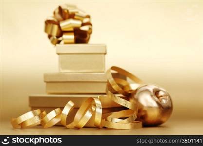 golden christmas gifts on gold background