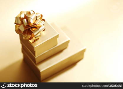 golden christmas gifts on gold background