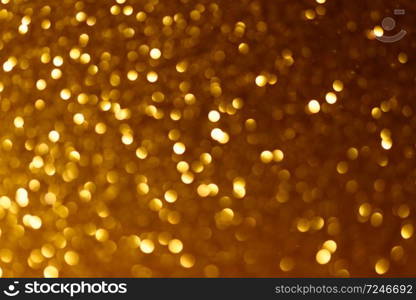 Golden Christmas or New Year festive background. Yellow Christmas or New Year background