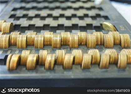 Golden coins on a black dust tray