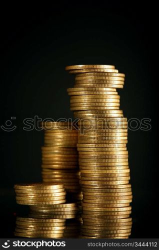 golden coins on black background