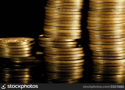 golden coins on black background
