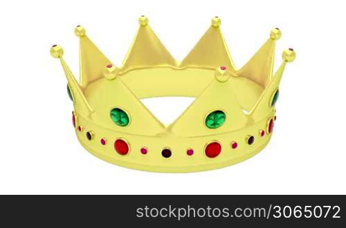 Golden crown rotates on white background
